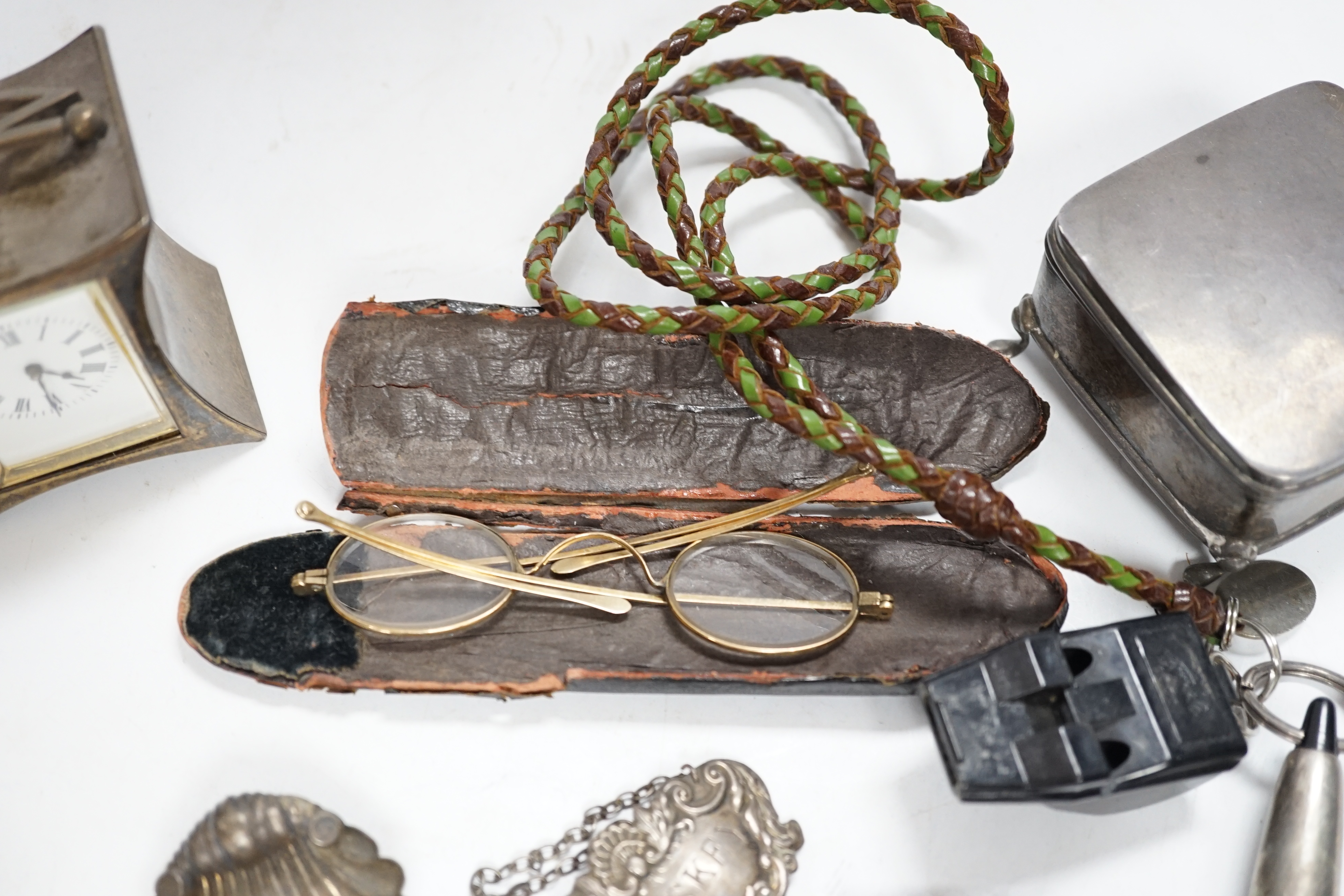 A group of small silver including a late Victorian carriage timepiece with later movement?, trinket box, quaich, vesta case, salt etc.